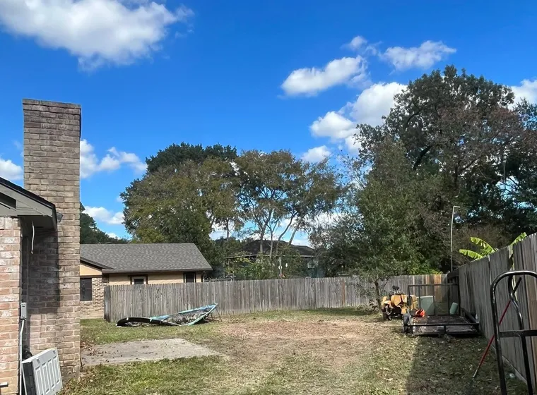A back lot cleared back to open ground